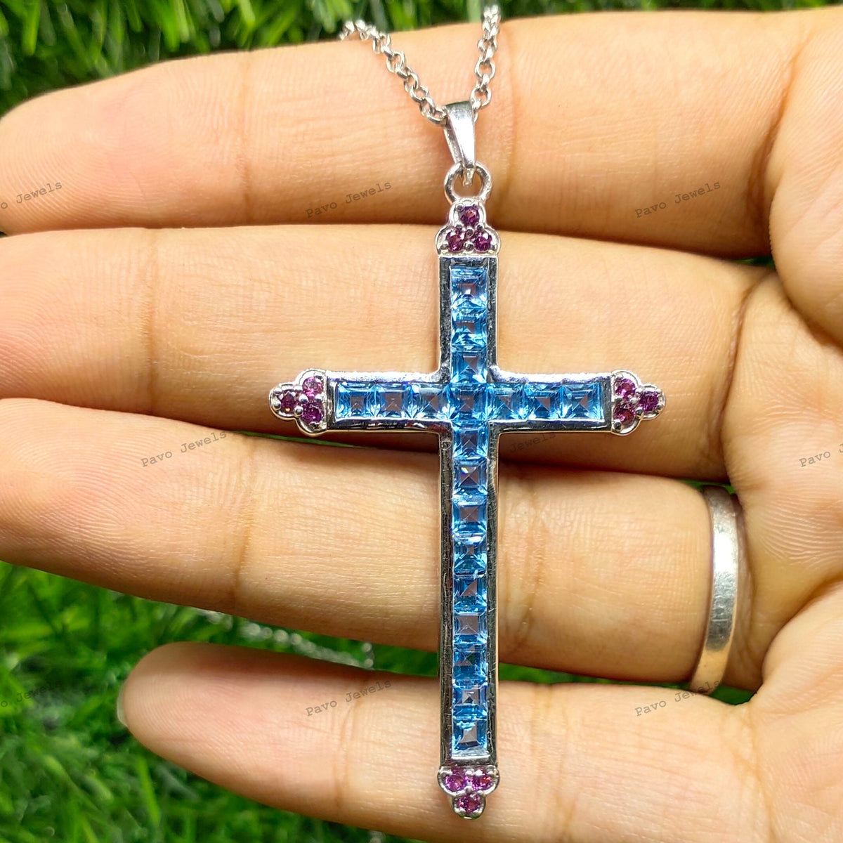 Swiss Blue Topaz Cross Pendant: Sterling Silver Garnet Accent
