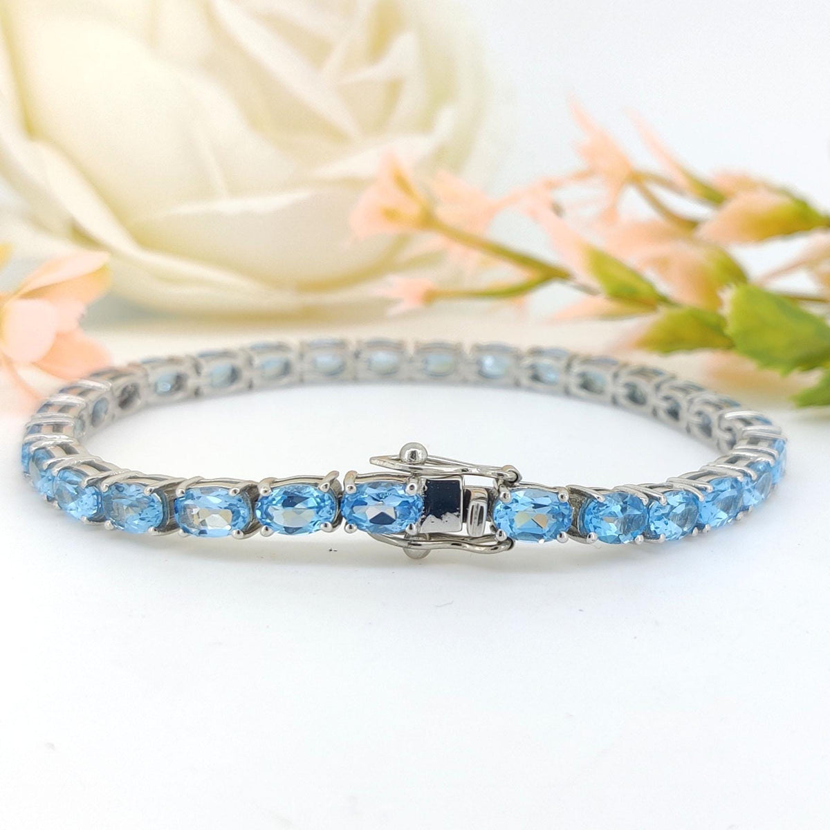 Swiss Blue Topaz Tennis Bracelet: Sterling Silver Oval Gemstone, December Birthstone