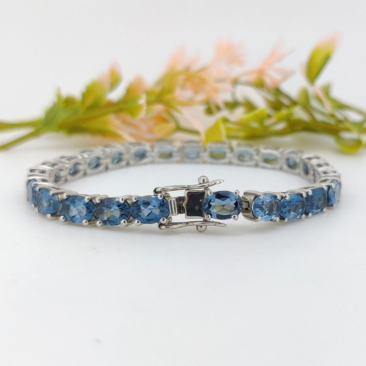 London Blue Topaz Tennis Bracelet: Sterling Silver Oval Gemstone, December Birthstone