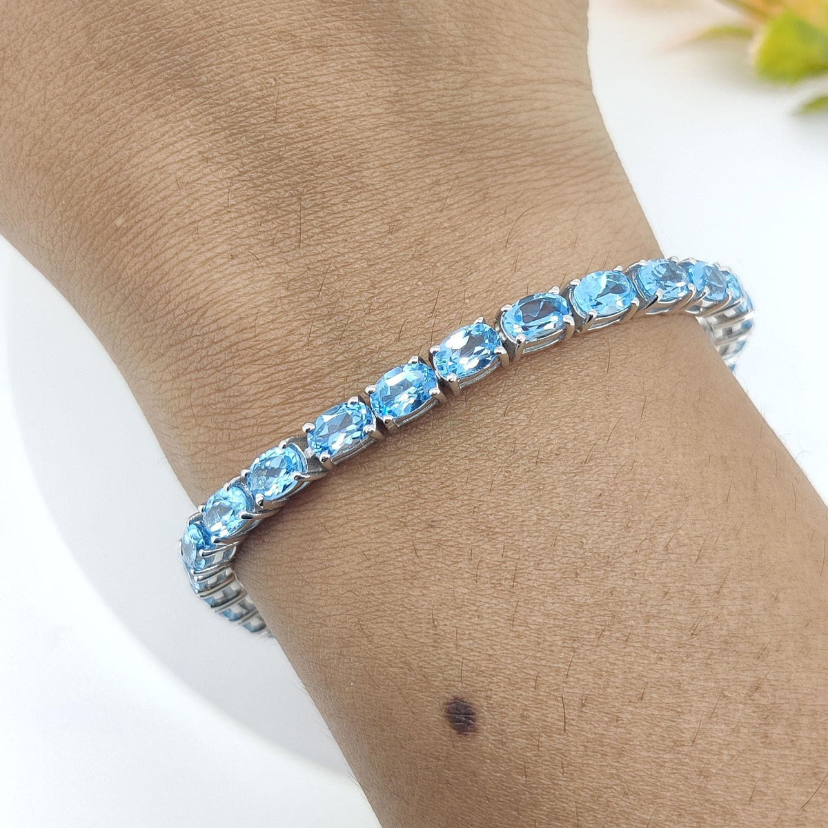 Swiss Blue Topaz Tennis Bracelet: Sterling Silver Oval Gemstone, December Birthstone