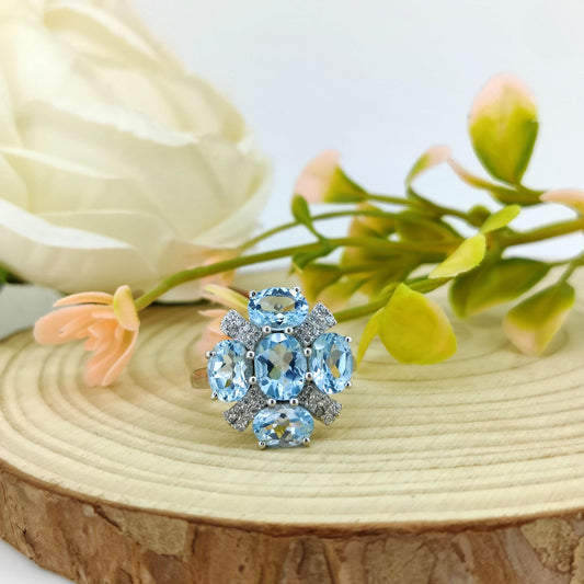 Blue Topaz Flower Ring: Sterling Silver December Birthstone