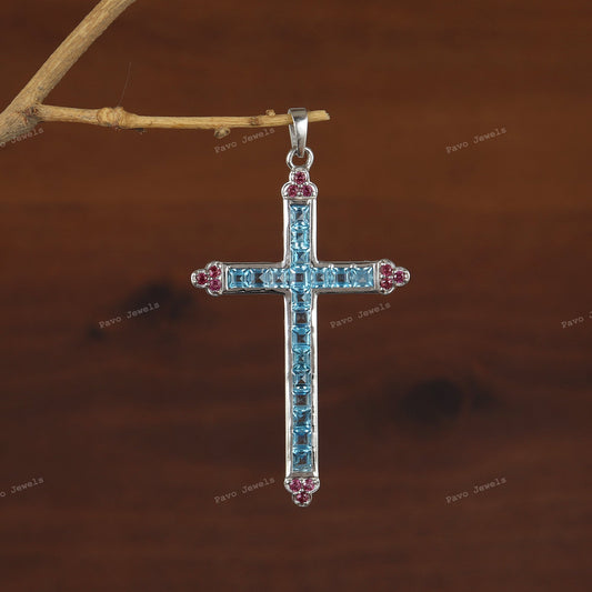 Swiss Blue Topaz Cross Pendant: Sterling Silver Garnet Accent