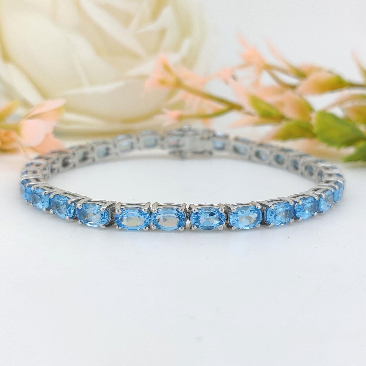 Swiss Blue Topaz Tennis Bracelet: Sterling Silver Oval Gemstone, December Birthstone
