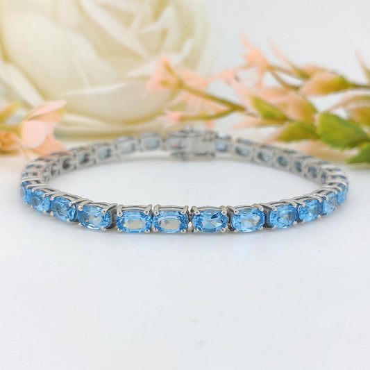 Swiss Blue Topaz Tennis Bracelet: Sterling Silver Oval Gemstone, December Birthstone